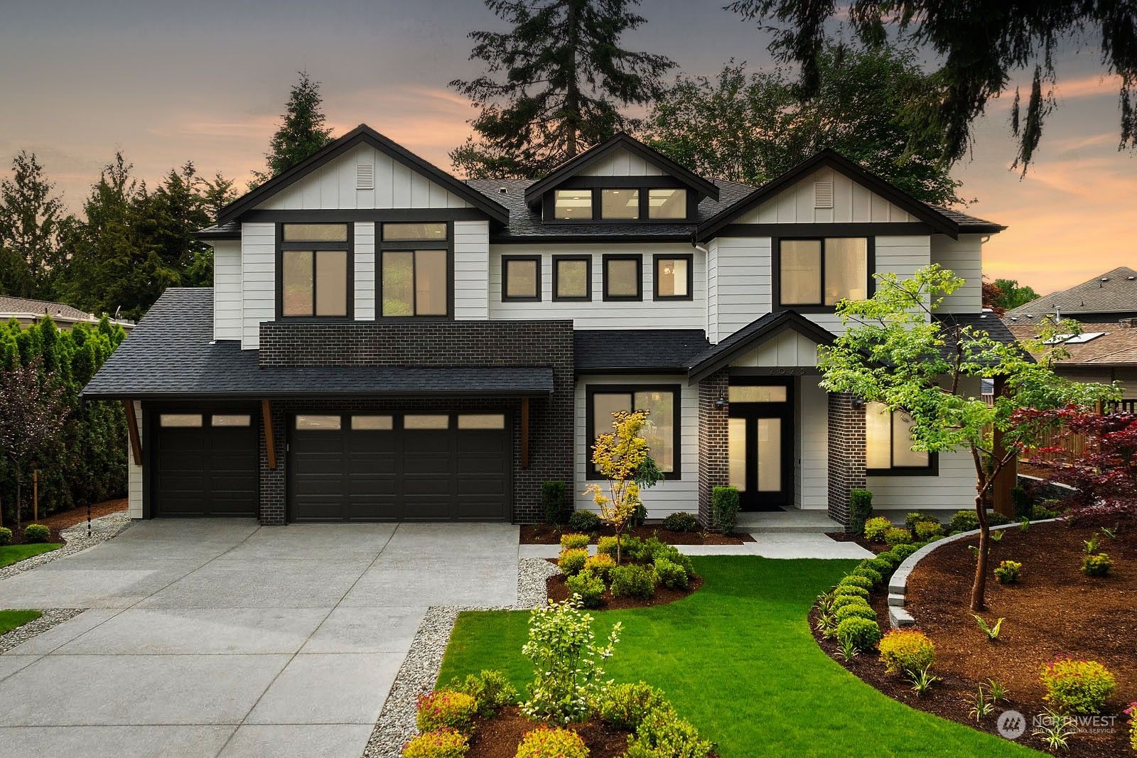 Front of 2025 208th Place NE, Sammamish, a new home with a three-car garage