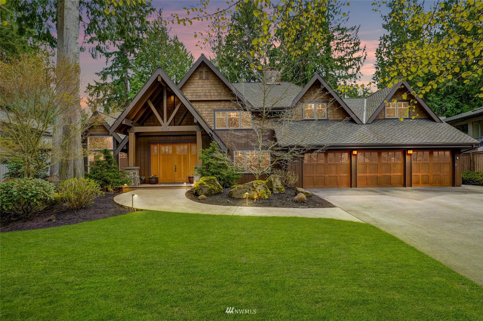 Lodge-style front of 21713 NE 29th Street, Sammamish, with wood garage doors