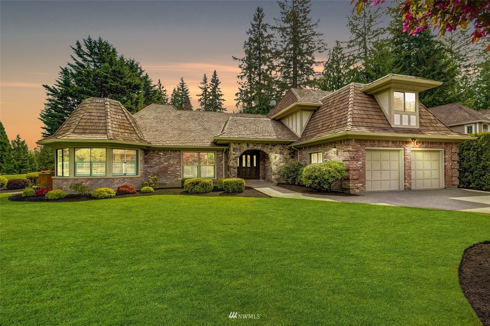 Brick and shingle front of 21815 NE 29th Street, Sammamish, across a wide lawn