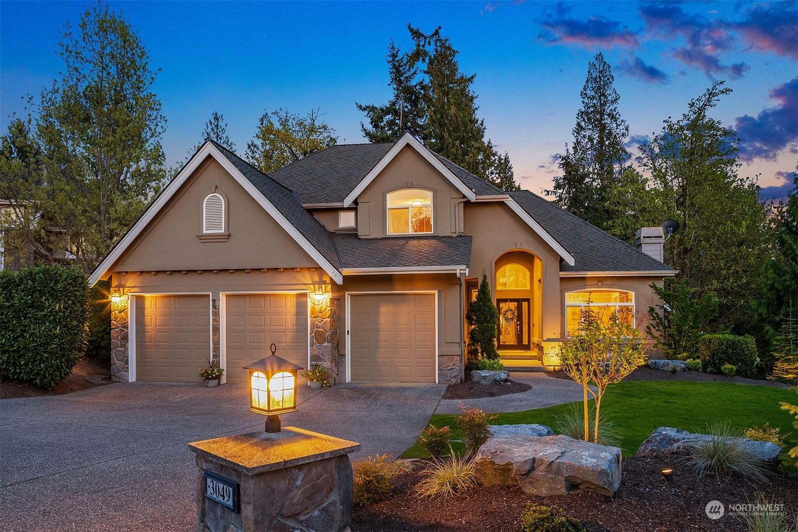 Front of 3049 205th Court NE, Sammamish, lit up at dusk