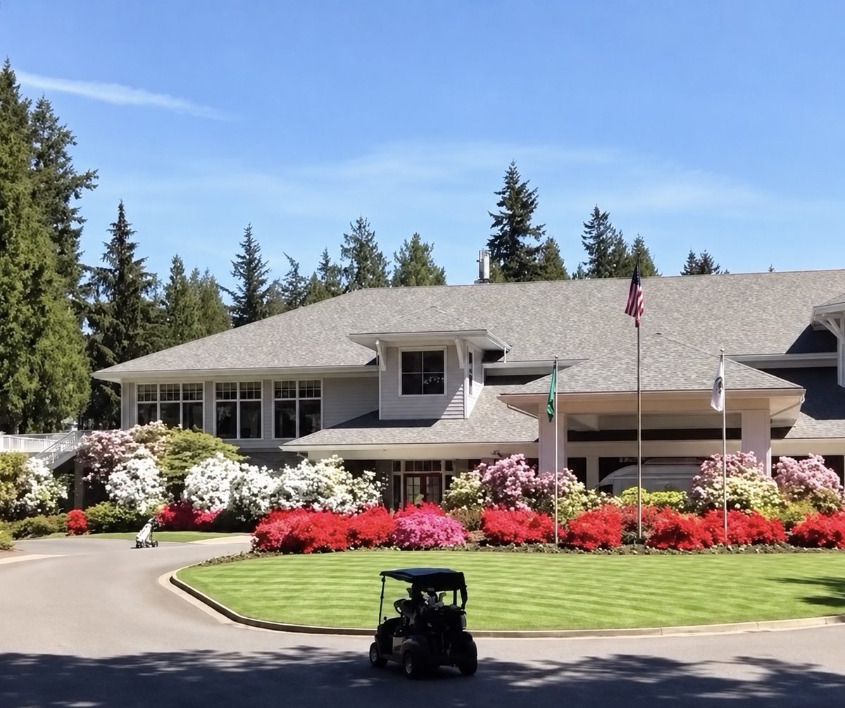 Sahalee Country Club clubhouse with blooming azaleas and rhododendrons along the entry drive